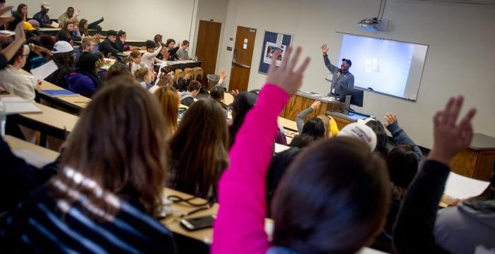 A professor interacts with the classroom